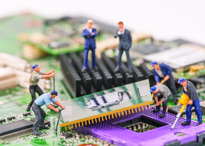 miniature people repair cpu board,teamwork and technology concep