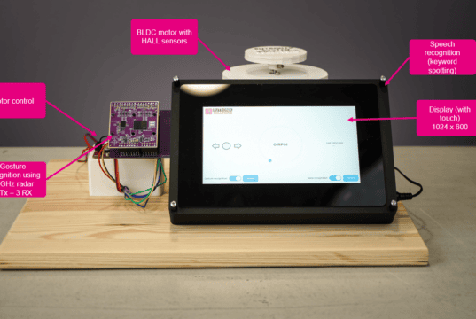 Gestos, voz y visualización HMI compacta con IA en el edge Vista general del demostrador con pantalla, módulo radar, placa de microcontrolador y motor